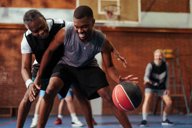 istock Joyful friends playing basketball. 2155479784