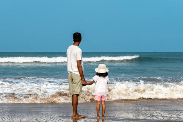 istock A father and his young daughter walk hand in hand 2155479816