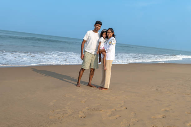 istock Beach Bonding Father Mother and Daughter Enjoying the Waves 2155480307