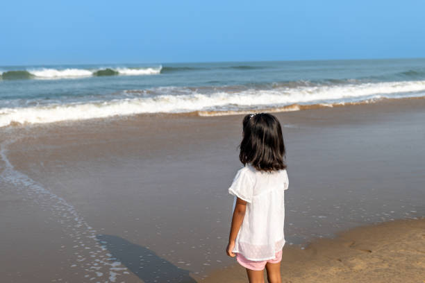 istock Girl by the Ocean 2155480323