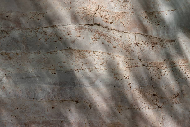 istock The sun is shining through the old brick cracked wall. 2155480392