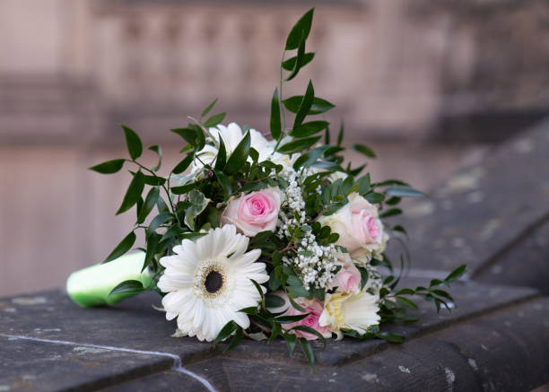 istock bride's bouquet lies on a stone. Beautiful wedding details 2155481272
