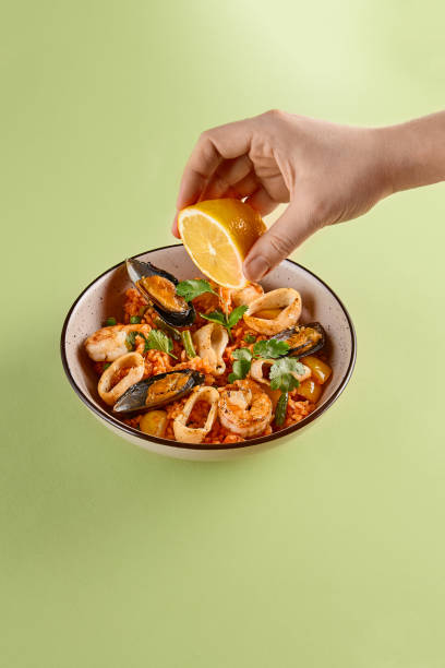 Delicious Seafood Fried Rice with Lemon Garnish - A Culinary Delight