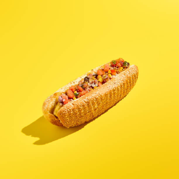 istock Tempting American cheesesteak with marbled beef, vegetable salsa, and a sesame bun on a yellow background. A minimalist and modern take on food photography emphasizes this scrumptious street food 2155482217