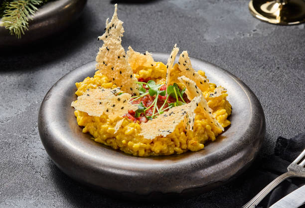 Milanese risotto with beef tartare and Parmesan crisps, aesthetically pleasing and elegant