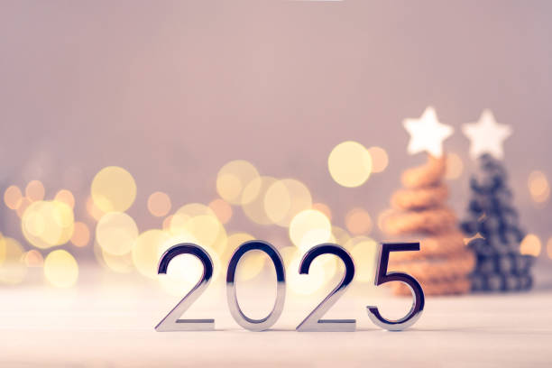 istock Metal numbers 2025 on table with bokeh lights. 2155484260