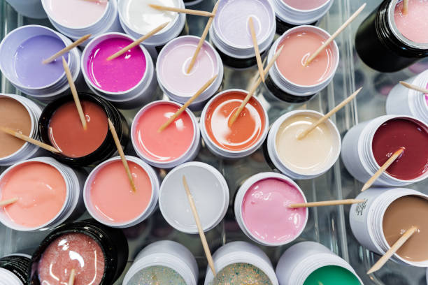 Various colored paints, including Light Pink, Violet, Magenta, are on the table