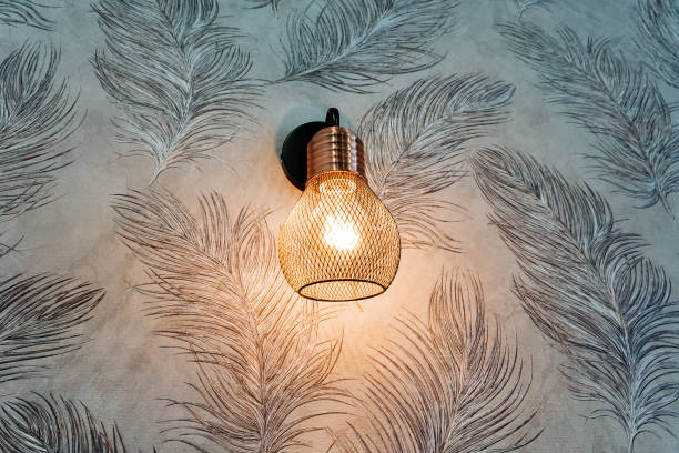 Feathered light bulb art piece illuminates underwater landscape