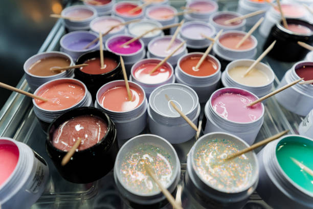 istock Colorful acrylic nails with sticks, resembling fast food ingredients 2155484624