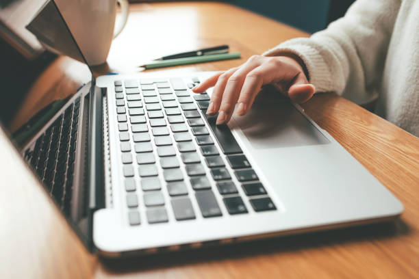 istock Young woman working in home on her laptop computer. 2155485717
