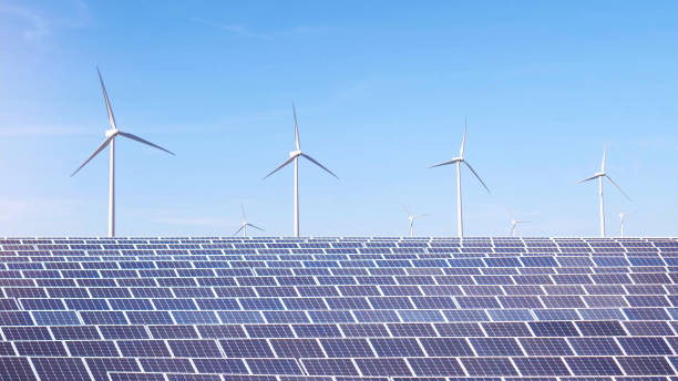 istock Solar panels with windmills in the background. Clean and renewable energy concept. Selective focus 2155487261