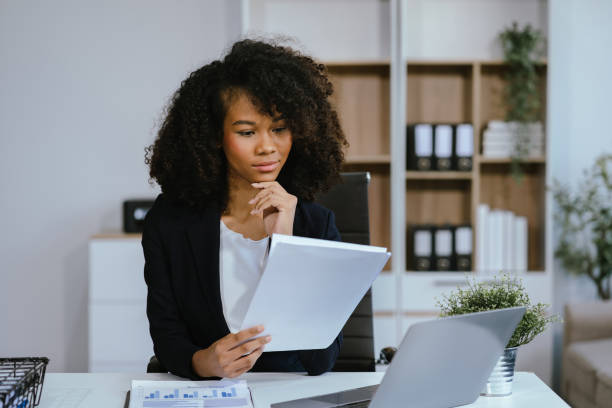 istock Female writes information businessman working on laptop computer writing business plan while sitting in office. 2155488439