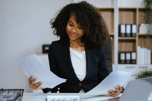 istock Female writes information businessman working on laptop computer writing business plan while sitting in office. 2155489315