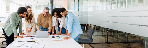 The diverse team of professionals engage in a dynamic exchange of ideas