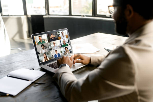 istock A modern businessman engages in a virtual meeting from his laptop 2155493474