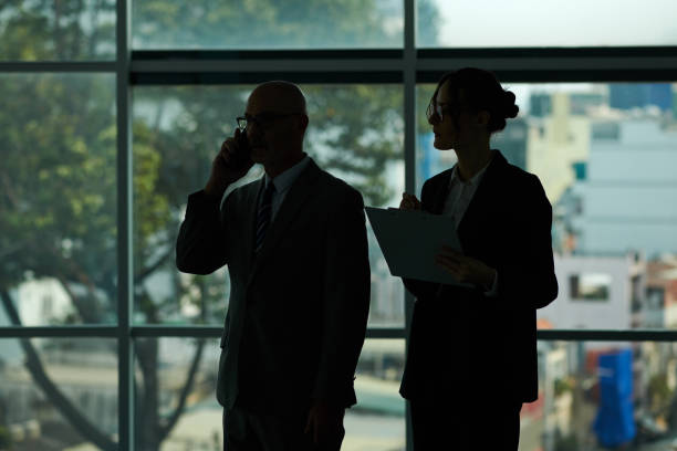 istock Silhouette of Businessman Talking on Phone 2155494797