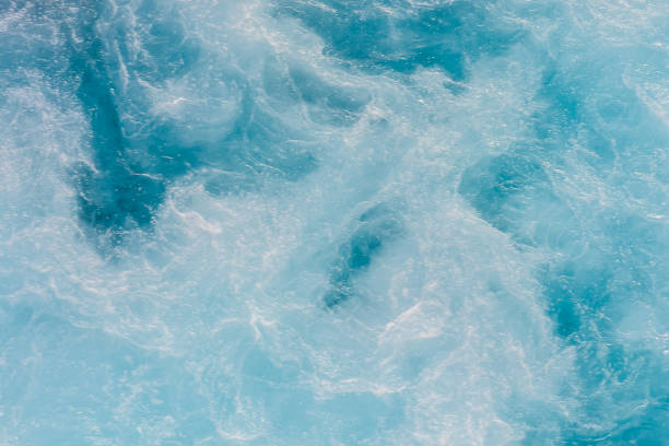 istock A beautiful blue ocean with waves crashing against the shore 2155494976