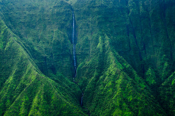 Aerial view of steep mountains, valleys and waterfalls in Kauai, Hawaii