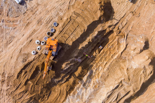 istock During earthworks at construction site, an excavator prepares a trench for sewer pipes 2155496145