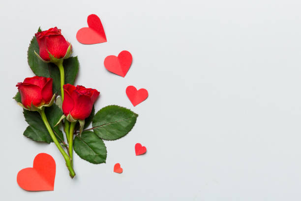 istock Valentine day composition with rose flower and red heart on table. Top view, flat lay, copy space Holiday concept 2155496163