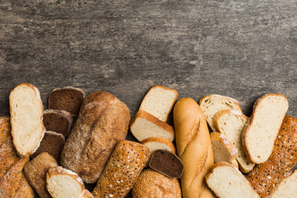 Homemade natural breads. Different kinds of fresh bread as background, top view with copy space