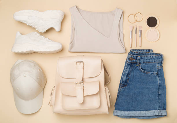 istock Flat lay with trendy spring outfit and flowers on color background 2155497281