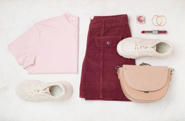 istock Flat lay with trendy spring outfit and flowers on concrete background 2155497284