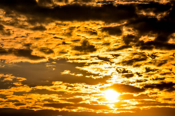 istock The sky is filled with clouds and the sun is shining through them 2155497695