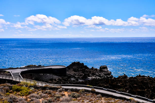 istock A beautiful blue ocean with a rocky shoreline 2155497755