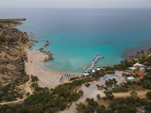 istock Above Konnos Beach aerial towards Turtle beach and Anthea's Cave cliffs 2155498244