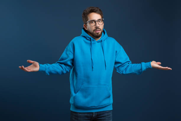 istock I Don't Know. Puzzled Young Man Shrugging Shoulders And Looking At Camera 2155498494