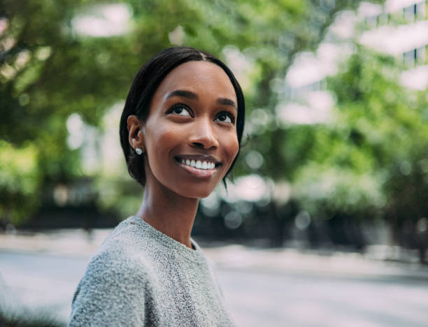 Smiling Woman Outdoors in a Peaceful Urban Setting