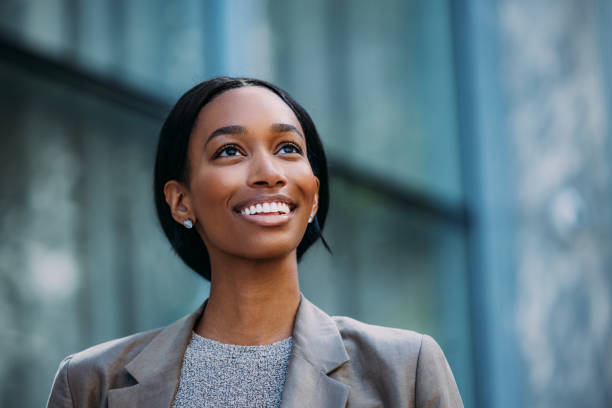 istock Confident Businesswoman Smiling Outdoors In Professional Attire 2155498710