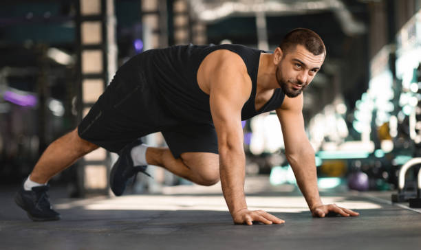 istock Motivated Muscular Man Making Running Plank Exercise While Training In Gym 2155499045