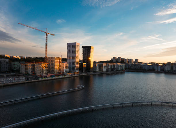 istock High angle view of buildings by a river during sunset 2155499330