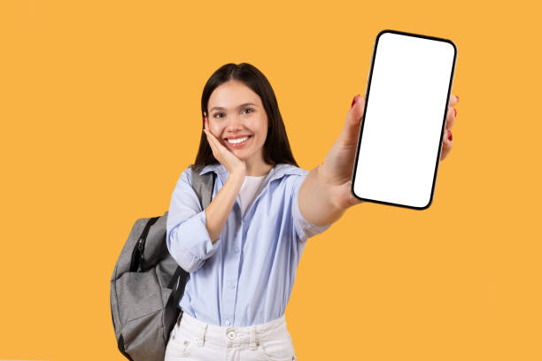 istock Happy lady student showing blank smartphone screen, educational app 2155499876