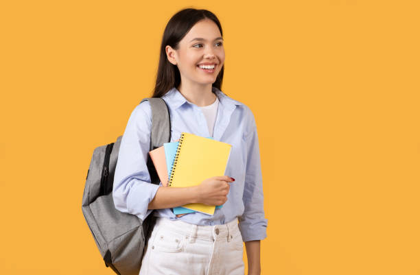 istock Smiling Girl Holding Notebooks, Looking Away, Copy Space 2155499898