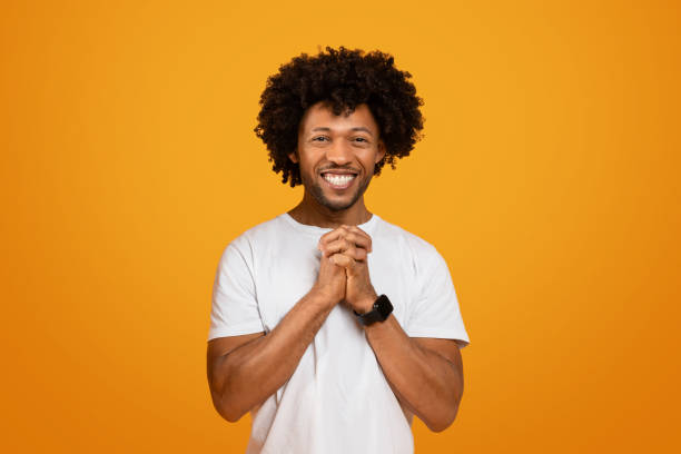 istock Excited african american guy holding hands in lock and smiling 2155500432