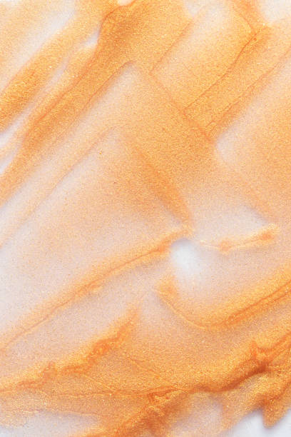 istock Shine golden cosmetic swatch on white background ,blush, highlighter, eye shadow, bronzer, lipstick texture 2155501855