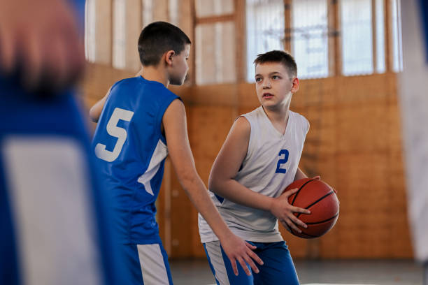 istock A young athlete is passing basketball during training at indoor court. 2155502462
