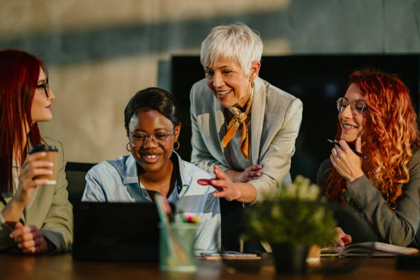 istock Old businesswoman explaining to her multiracial team business plan. 2155502467