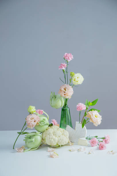 istock unusual composition of flowers, vegetables and cheese 2155502730