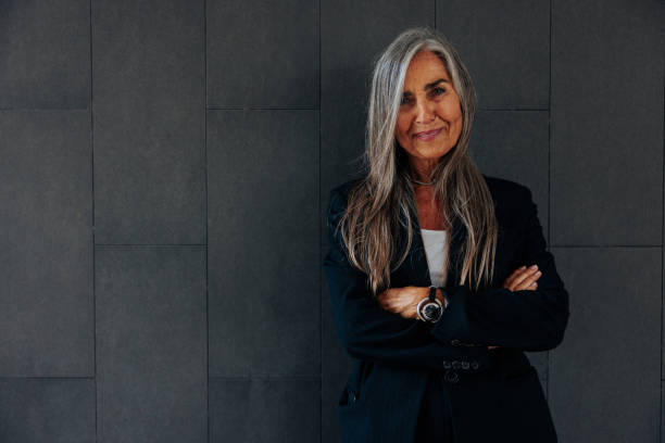 istock Senior businessperson on dark background 2155503079