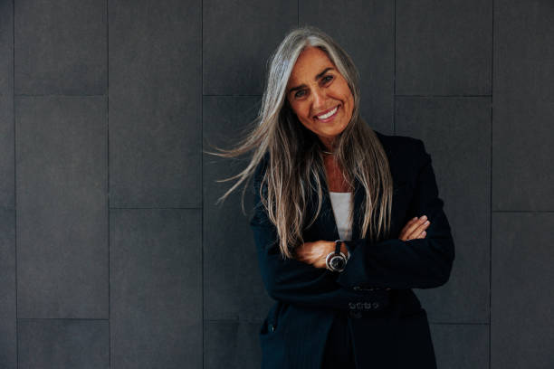 istock Satisfied businesswoman looking at camera with copy-space 2155503090