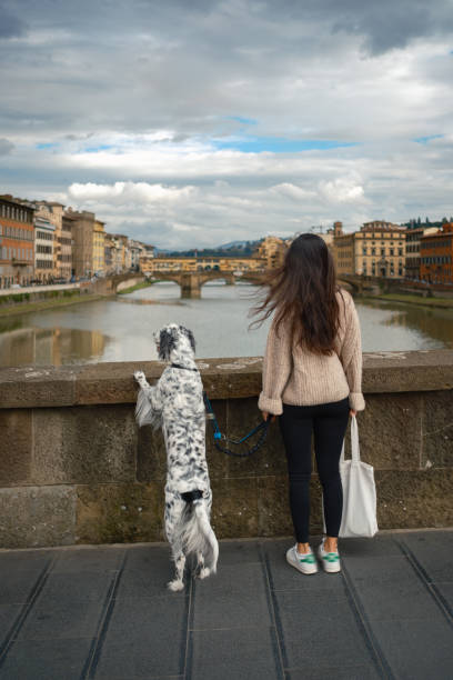 istock Girl and a dog enjoying view 2155505039