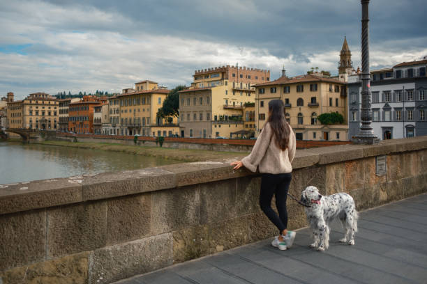 istock Girl walking the dalmatian dog 2155505424
