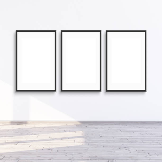 istock 3 frame mock up hanging on a white wall with sunlight, 3d render illustration. 2155507981