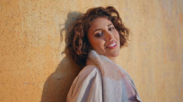 istock Closeup cheerful brunette looking camera in warm sunlight. Happy elegant woman 2155509309