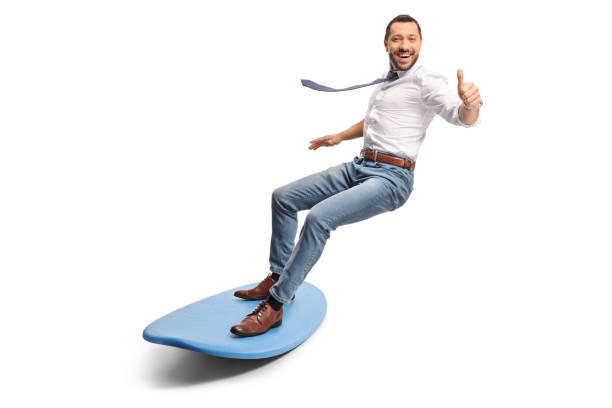 istock Happy businessman riding a surfboard and gesturing thumbs up 2155511902