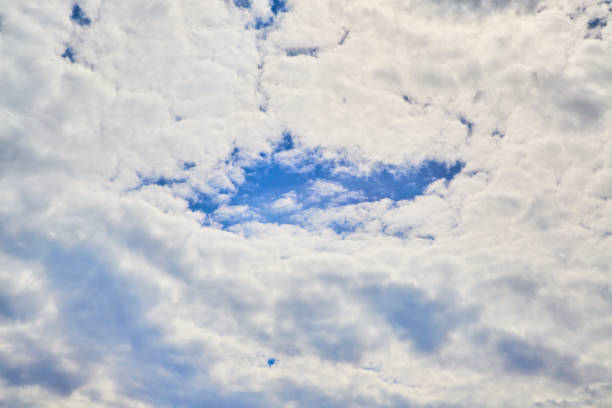 istock Swirling white clouds in the sky, large cloud formations in the sky, sky within the clouds 2155514607
